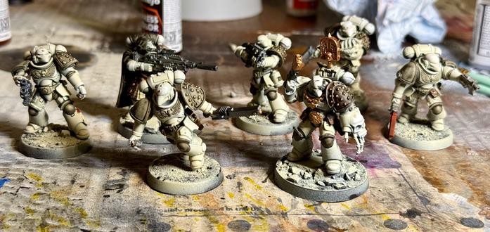 A collection of bone-coloured beaky space marines, painted to a basic standard. Washes to come.