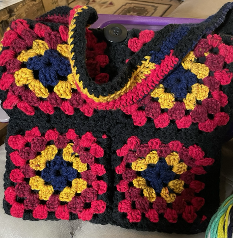 Red and black crocheted bag.