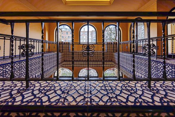 Wide angle view from the mezzanine floor in the Wielemans Art Deco Mansion by Architect Adrien Blomme (1926) in  Brussels, with a close-up on the hispanic tiles decoration. Blomme took into account his client's passion for Spain and drew the inspiration for his first sketches from the Alhambra in Granada.