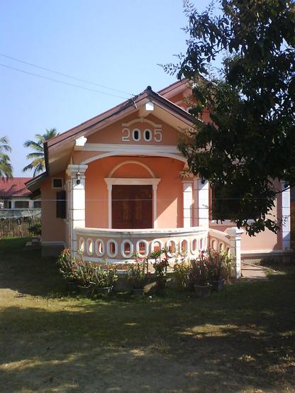 A house with a decorative “2005” ornament