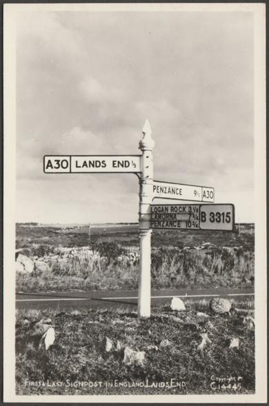 Monochrome real photographic postcard showing a view of the First and Last signpost or fingerpost at the Land's End in Cornwall.

Published by The R.A. (Postcards) Ltd, London, RA Series, No C14445, c.1950s.

Postally unused.

Very good condition, with minimal corner bumps, but extremely light mark to emulsion to left centre of top edge.