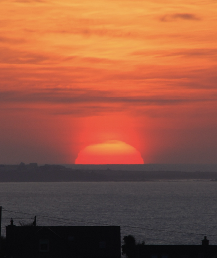 “Erupting with beauty and power...”. WOWW!! . An awesome lava-like ‘saharan dust sunrise’ ascends over Garrettstown beach in West Cork , Ireland on an amazing April morning!