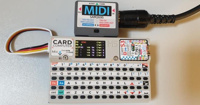 Image shows a Cardputer, a small pocket computer, with a Midi module connected to it, and some midi messages on the screen.