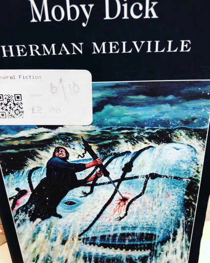 In this Moby Dick cover, a Charles Bronson lookalike has speared a whale and is being dragged overboard.