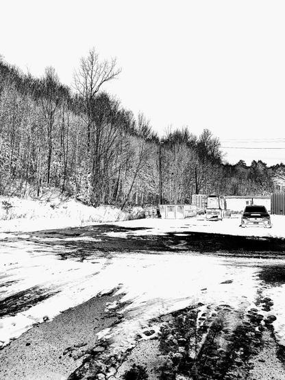 Solarization effect of a photo of a parking area, to the left and in the background is a snow covered wooded area. In the foreground is snow covered pavement. Further back is a parked car, front facing the viewer, behind the car are small cargo containers and  metal sheds.