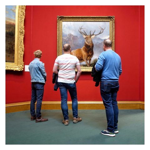 This is a square format colour image of three men standing in front of 'The Monarch of the Glen' in the National Gallery of Scotland. Taken with a Sony RX100.