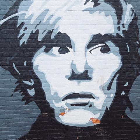 Portrait of Andy Warhol on the side of a building in Covington, Kentucky.