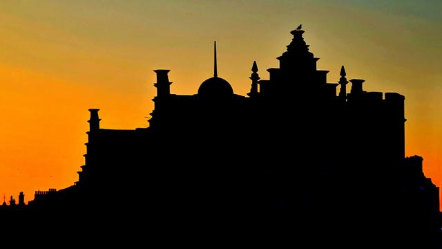 An ornate silhouette of an Edwardian Swage Pumping Works in Glasgow against an ornate sunset.