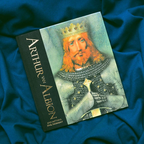 The book cover of Arthur of Albion. The title is in gold on black on the left side of the cover. To the right is an illustrations of a red-haired man wearing a crown and holding a sword in his hands.