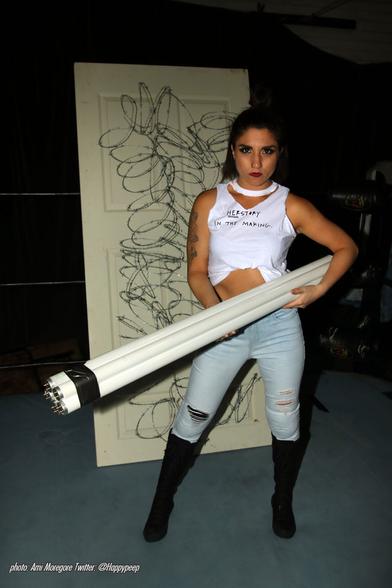 Kasey Catal holding a lighttube bundle
