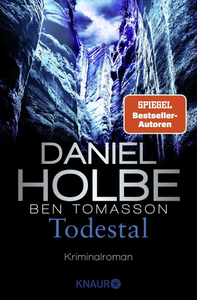 Ankündigung des Buchcovers für den Kriminalroman "Todestal". Es zeigt eine kaltblaue Schlucht.