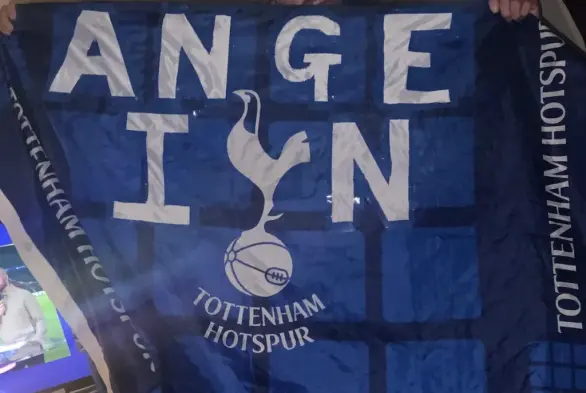 Tottenham flag with the words ‘Ange in’ added.