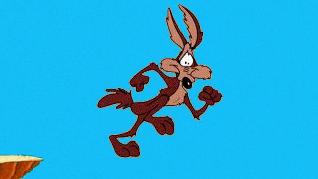 Wile E Coyote from the Roadrunner cartoon poised in mid-air after having run off the top of a cliff