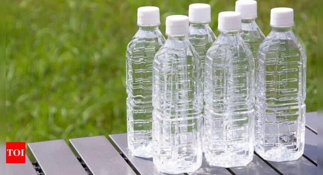 Why do the Japanese line their streets and fences with water bottles?