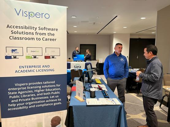 Vispero's Jerry Marindin at the Visispero at NCSAB speaking with an attendee about accessible software solutions.