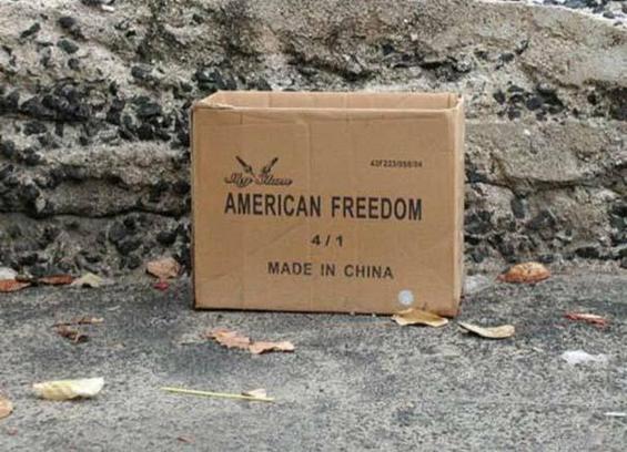A large cardboard box labeled "AMERICAN FREEDOM - Made in China"