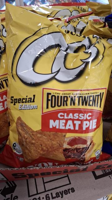 A yellow bag of CC's brand corn chips with a label pronouncing the flavour as 'Classic Meat Pie'