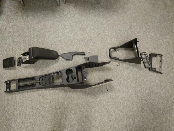Entire centre console of a VW Polo 6C + armrest, handbrake lever cover and various trim that has to be removed in stages
