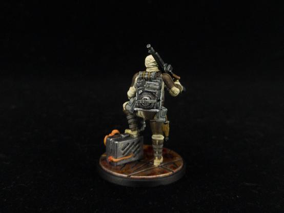 Dengar from the back showing backpack details.