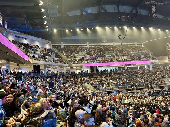 Picture of a multi-level arena packed with Critical Role fans, many of whom are in cosplay.