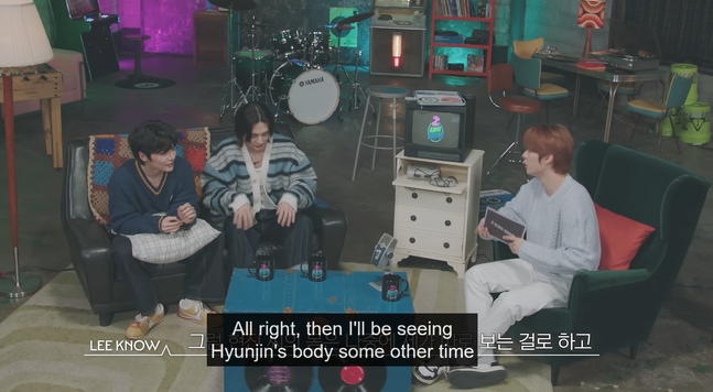 Lee Know interviewing I.N and Hyunjin on the 2 Kids Room show. Lee Know says, "All right, then I'll be seeing Hyunjin's body some other time"