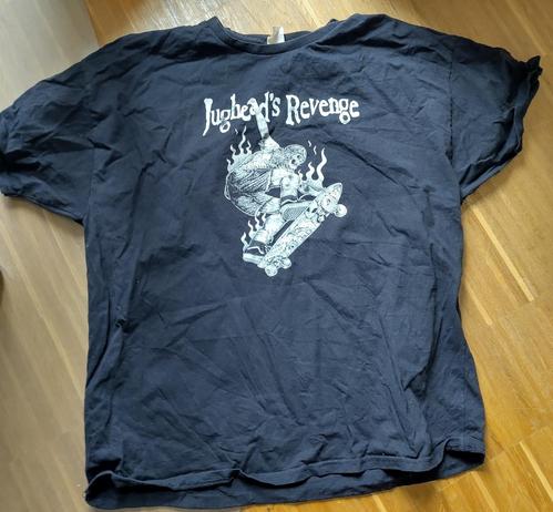 black shirt on wooden ground, font says Jughead's Revenge, and you can see the classic skateboarder motive
