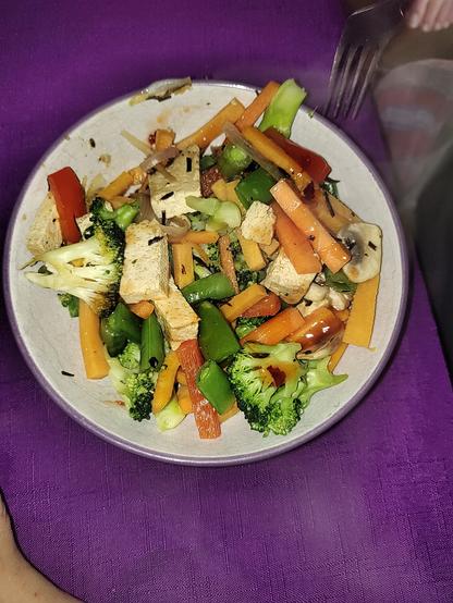 Wife's dinner: carrots, broccoli, sugar snap peas, sweet potato, shallot, red peppers, mushroom and seaweed. Purple tablecloth.