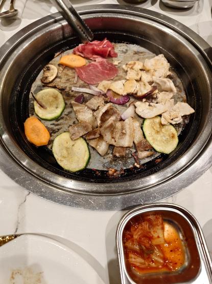 The barbecue with the meat (pork, turkey and beef) and some veggies (carrots, zucchini, mushrooms and red onions)

+ Rice and kimchi