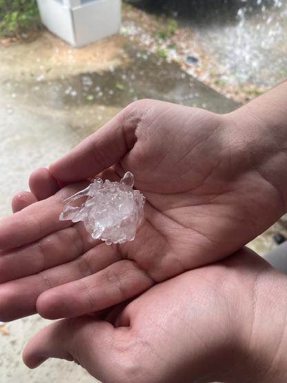 Golf ball size hail in a hand