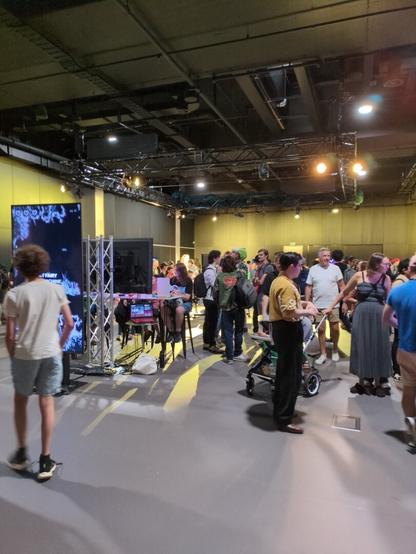 Inside the main event hall. Rows of consoles and games.