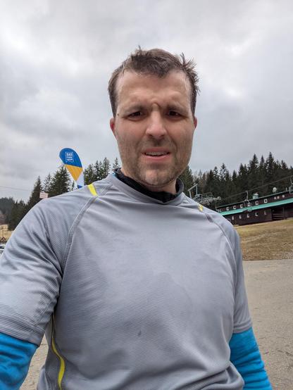A selfie of the post author after the run, sweaty and not so smiling any more.