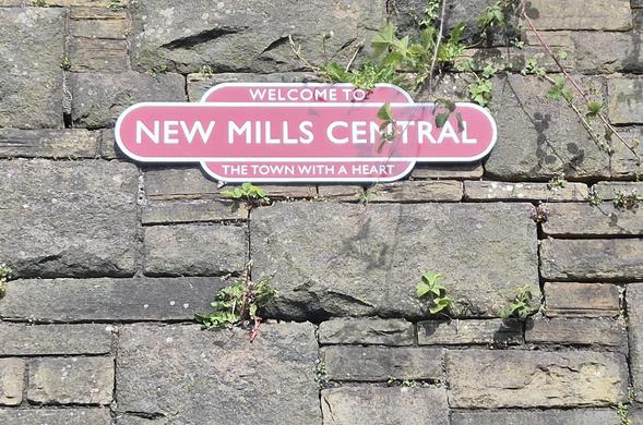 Train station platform sign for New Mills, which features in one of my favourite HMHB songs.