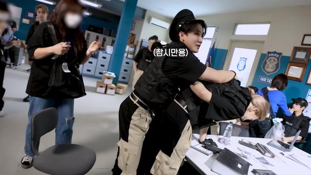 Changbin has bent Hyunjin over a desk with arms behind his back