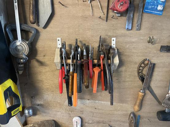 Pliers displayed on the wooden structure