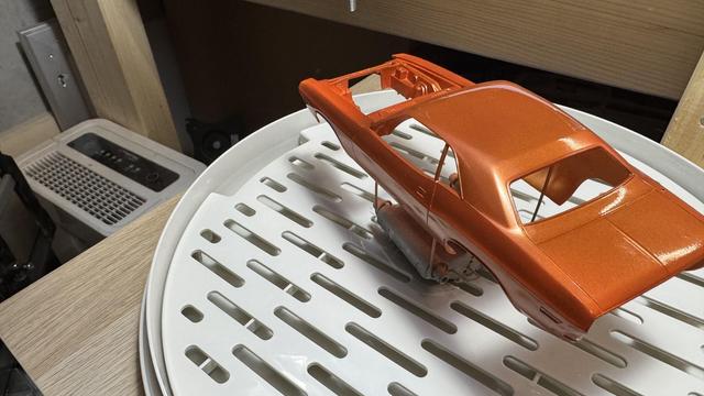 1970s Dodge Challenger body in glossy orange by Revell in 1:24