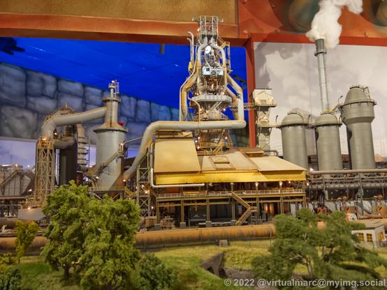 A photo of a steelworks from the front of a model railway.