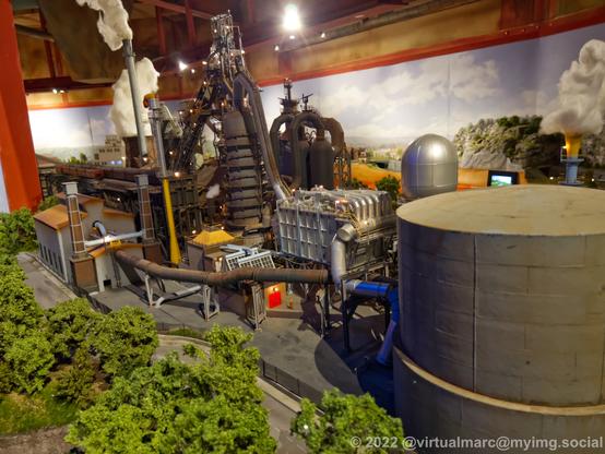 A photo of the back of a steelworks on a model railway.