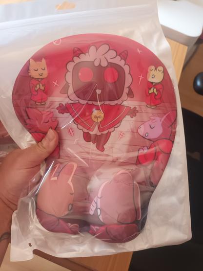 Photo of a Cult of the Lamb "titty" mousepad (its safe for work)
