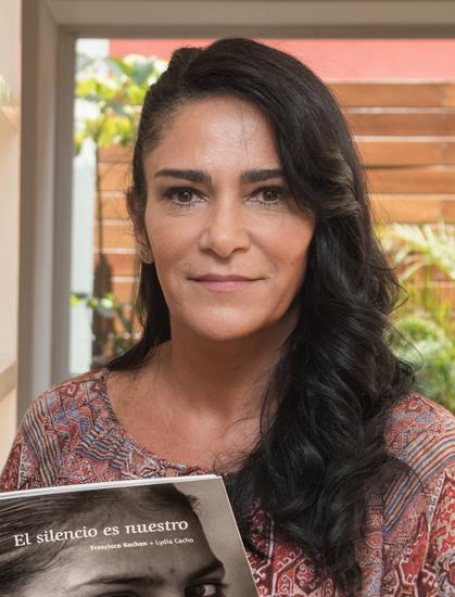 Cacho, looking directly at the camera, smiling, with long black hair. By Eneas De Troya - https://www.flickr.com/photos/eneas/21583878214, CC BY 2.0, https://commons.wikimedia.org/w/index.php?curid=86503413