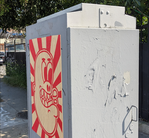Poster on a utility box with an image similar to goblin graffiti I've seen
