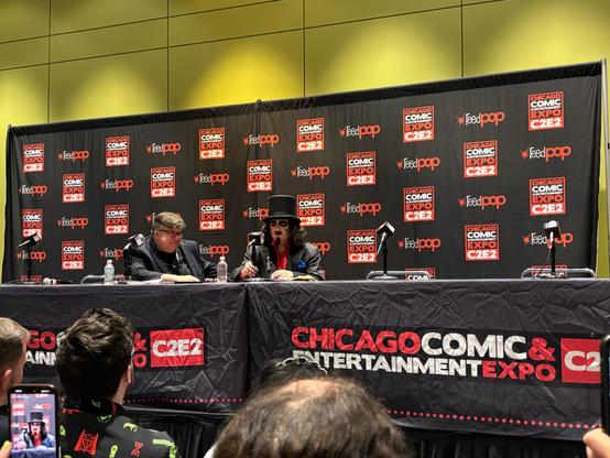 Legendary Chicago horror host Svengoolie is seated onstage next to moderator John Siuntres at the C2E2 panel Svengoolie Spotlight