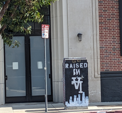 Utility box with Raised in LA in it. LA is upside down
