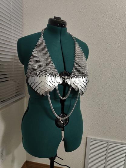A front view of the chainmail piece described in the post. It is modeled on a mannequin with a plain background.