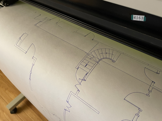 An otherwise decent floor plan on a pen plotter until it crapped out and drew a line through the whole damn thing