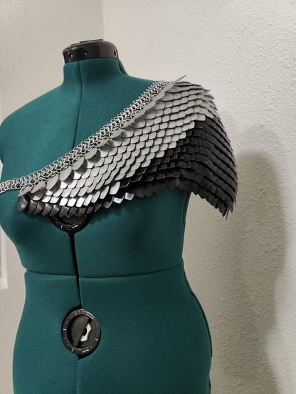 An angled front view of the piece described in the post. It is modeled on a mannequin with a plain background.