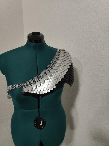 A front view of the piece described in the post. It is modeled on a mannequin with a plain background.