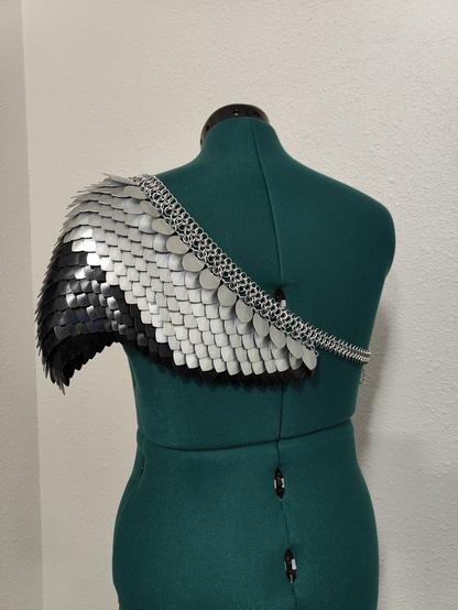 A back view of the piece described in the post. It is modeled on a mannequin with a plain background.