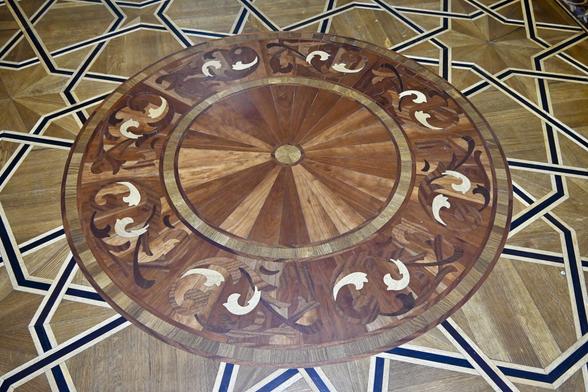 Wooden floor with intricate marquetry inside a mosque in Khiva, Uzbekistan