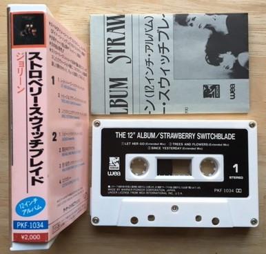 A photo of the spine of Strawberry Switchblade's The 12 Inch Album on cassette, with the cassette istelsef and a folded insert leaflet.