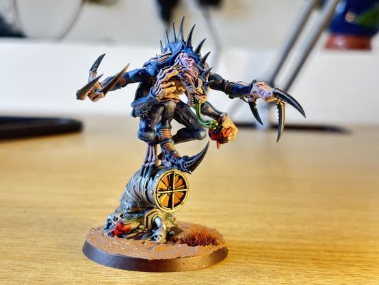 Genestealer Cults Patriarch miniature painted with purplish skin and blue carapace.